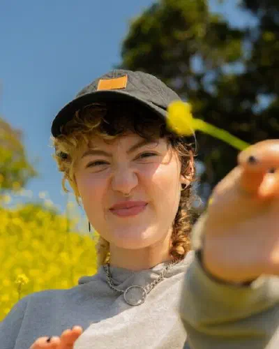 Portrait of a nonbinary autistic person outdoors